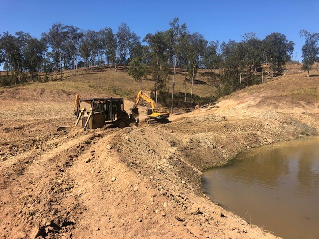 land clearing and excavation dam construction in Kybong